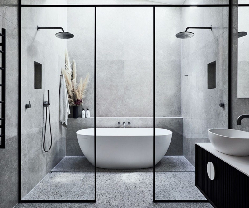 Spa-Like Minimalist Bathroom with Dual Shower Heads & Black Framed Glass