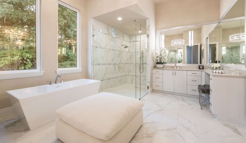 Spacious Luxury Bathroom with Central Ottoman & Tub