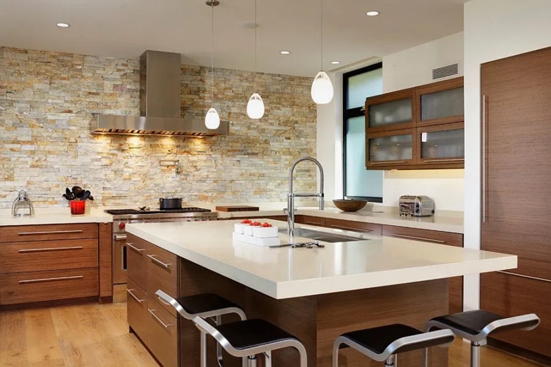 Stone Accent Wall Kitchen Design with Warm Wood Grain Cabinetry