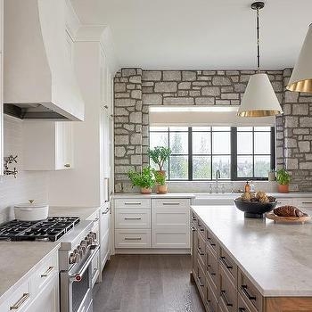 Stone Kitchen Accent Wall surrounding Large Black Grid Window