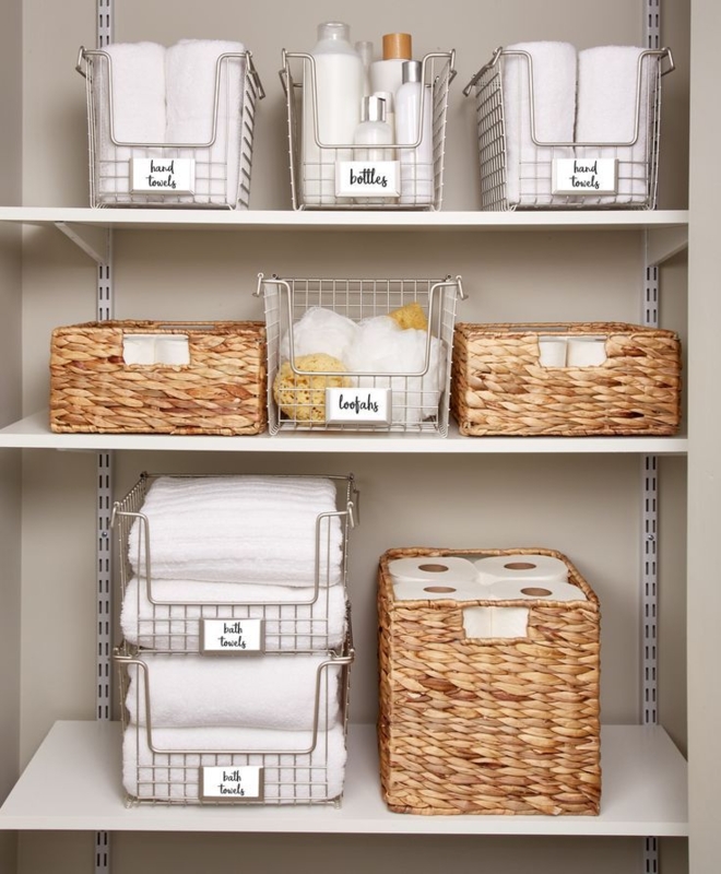 Storage Basket system with handwritten labels on mixed wire and woven bins. SEO: closet solutions.