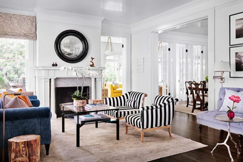 Striped Accent Chairs and Navy Sofa in a Transitional Living Room
