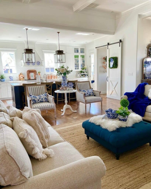 Striped Armchairs Paired with a Navy Tufted Ottoman