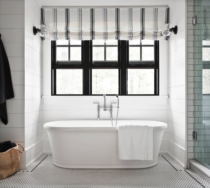 Striped Roman Shade over Freestanding Bathtub with Black Frames