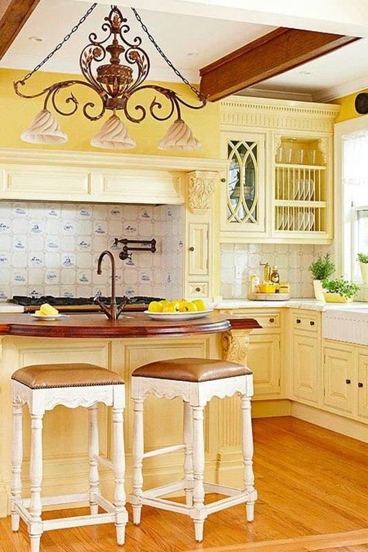 Sunny Yellow French Country Kitchen with Blue and White Tile.