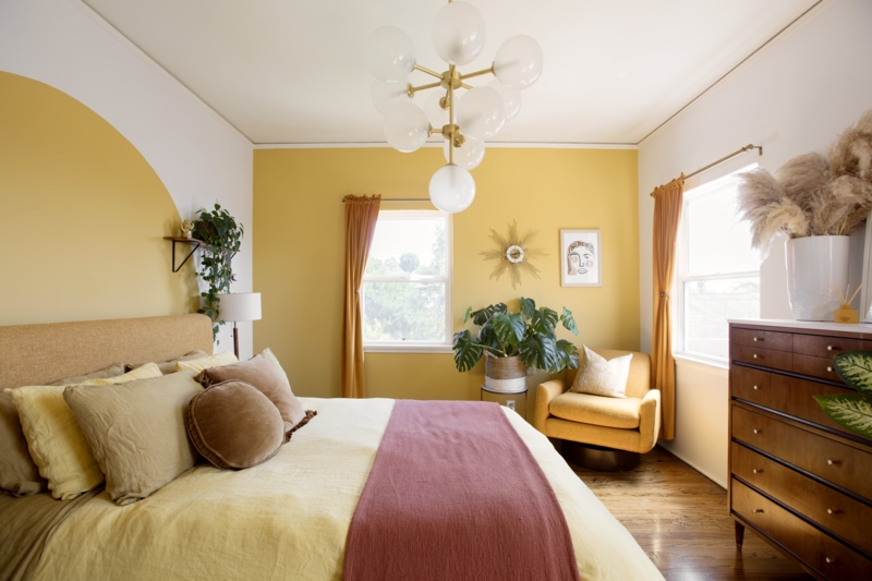 Swivel Barrel Chair in Mustard Yellow with a Boho Painted Wall Arch