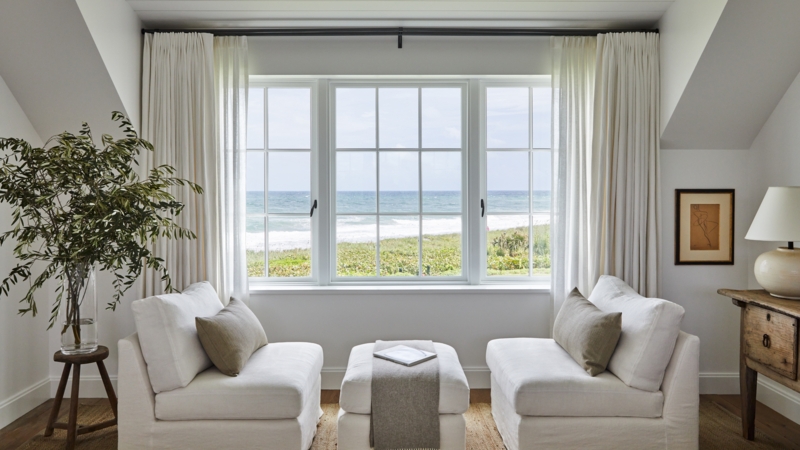 Symmetrical Armchair Seating Arrangement in a Minimalist Coastal Room