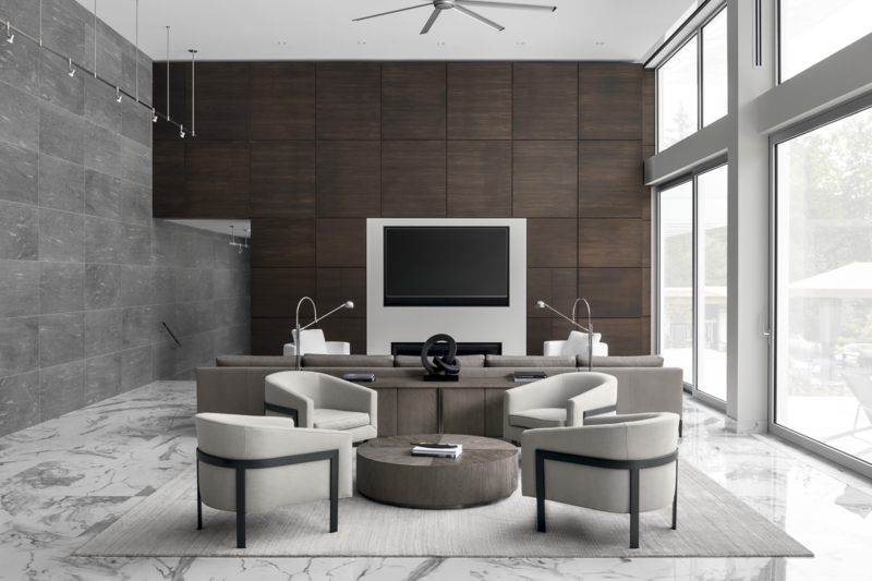 Symmetrical Four Chair Seating Layout with Dark Wood Grid Accent Wall