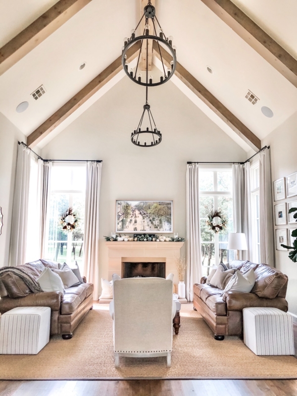 Symmetrical Living Room Layout with Vaulted Ceiling and Wheel Chandeliers