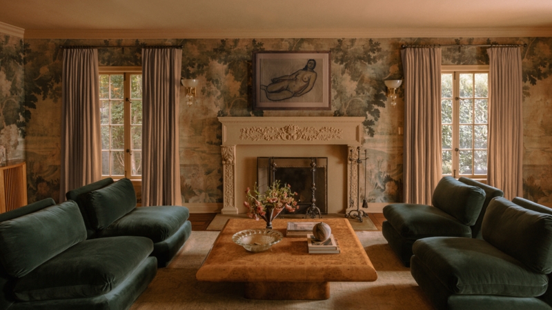 Symmetrical Living Room Seating Layout with Scenic Mural Wallpaper