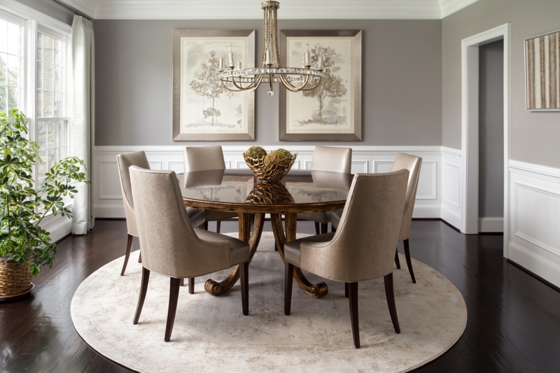 Symmetrical Wall Art with Round Pedestal Table & Taupe Chairs