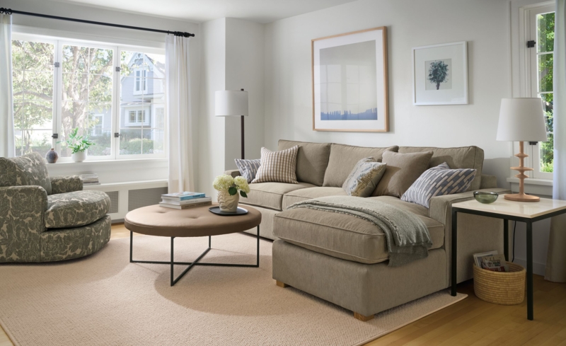 Tan Sectional Sofa with Patterned Swivel Chair and Ottoman