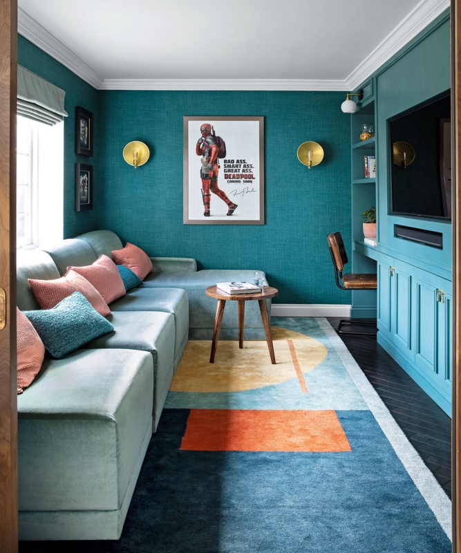 Teal Den with Custom Built-ins and Geometric Accent Rug design