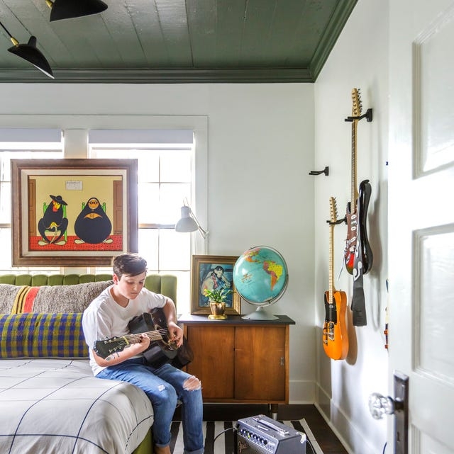 Teen Bedroom displaying Dark Green Plank Ceiling and Guitar Display