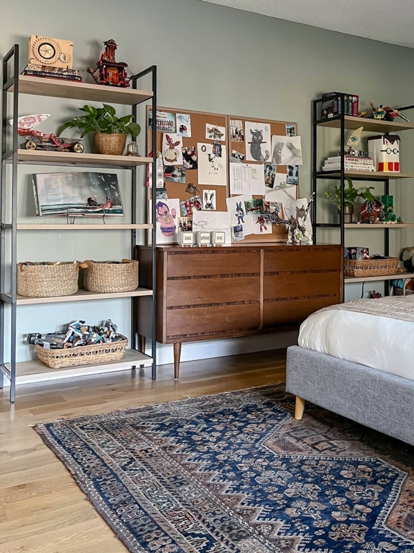 Teen Bedroom displaying Sage Green Walls and Industrial Open Shelving