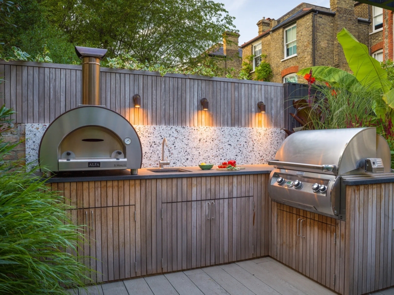 Terrazzo Backsplash Outdoor Kitchen with Vertical Wood Paneling