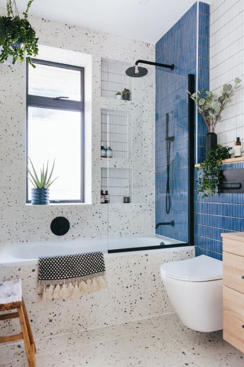 Terrazzo Tile Bathroom with Blue Vertical Stack Tiles and Black Accents