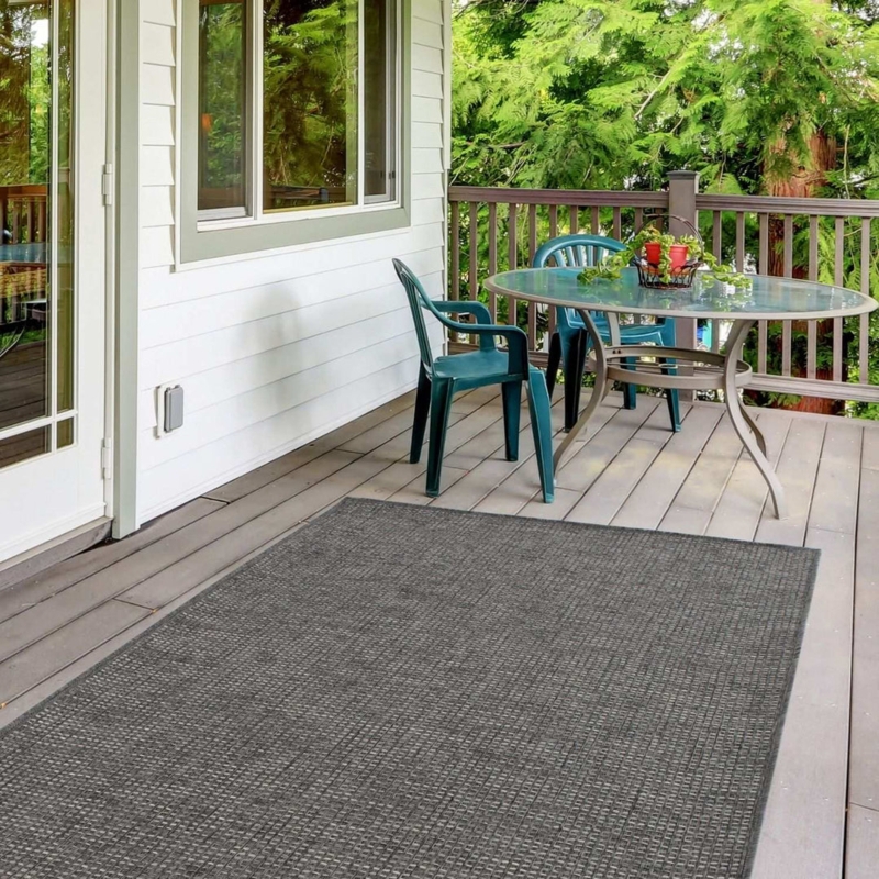 Textured Outdoor Living Space Layout Dark Woven Low Profile Patio