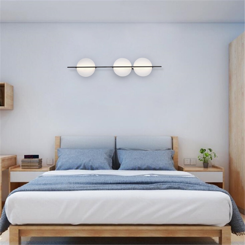 Three-Light Wall Sconce Globe Shades Matte Black Horizontal Bar