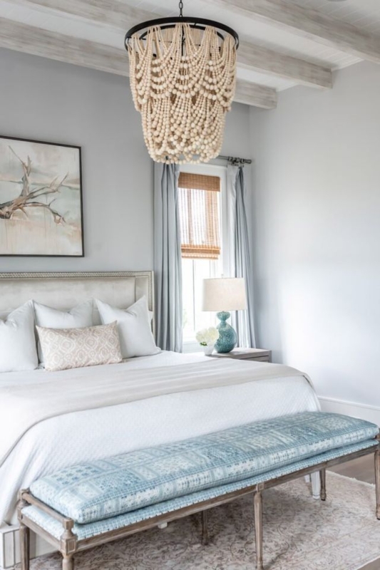 Tiered Beaded Chandelier and Whitewashed Ceiling Beams in Coastal Room