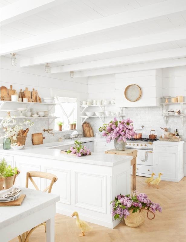 Tiered Open Shelving in a White Farmhouse Kitchen with Exposed Beams