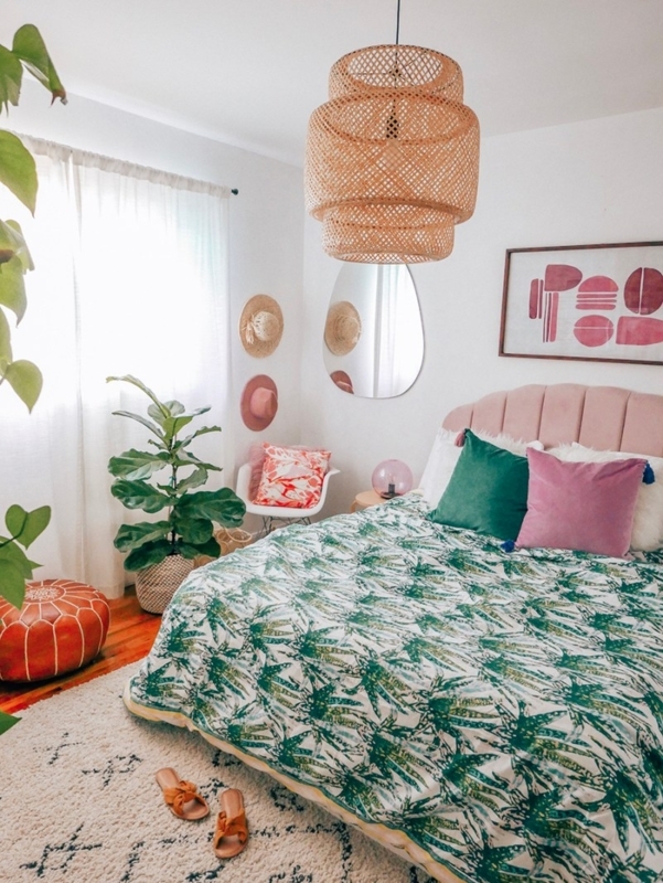 Tiered Rattan Pendant and Pink Velvet Headboard in a Boho Bedroom