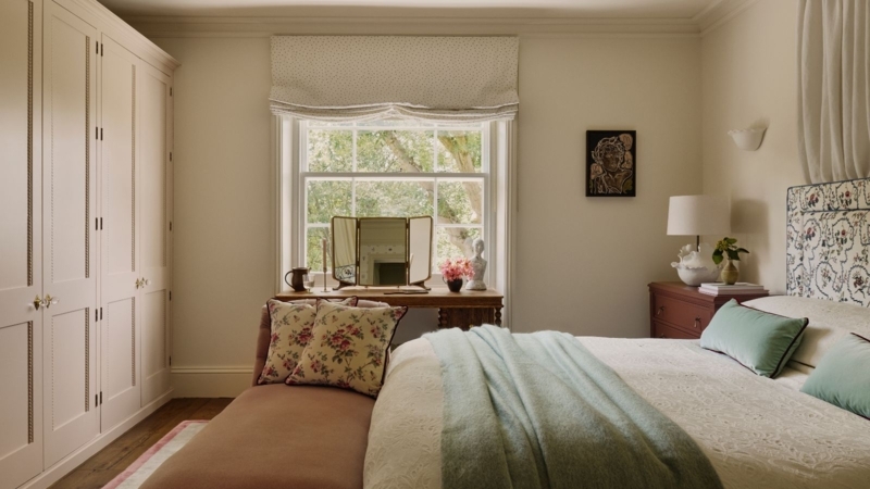 Traditional Bedroom with Paneled Cream Wardrobes and Window Vanity