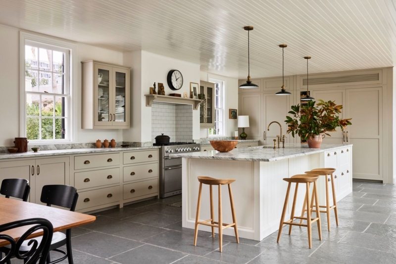 Traditional Kitchen: Large Format Stone Floor and Taupe Shaker Cabinets