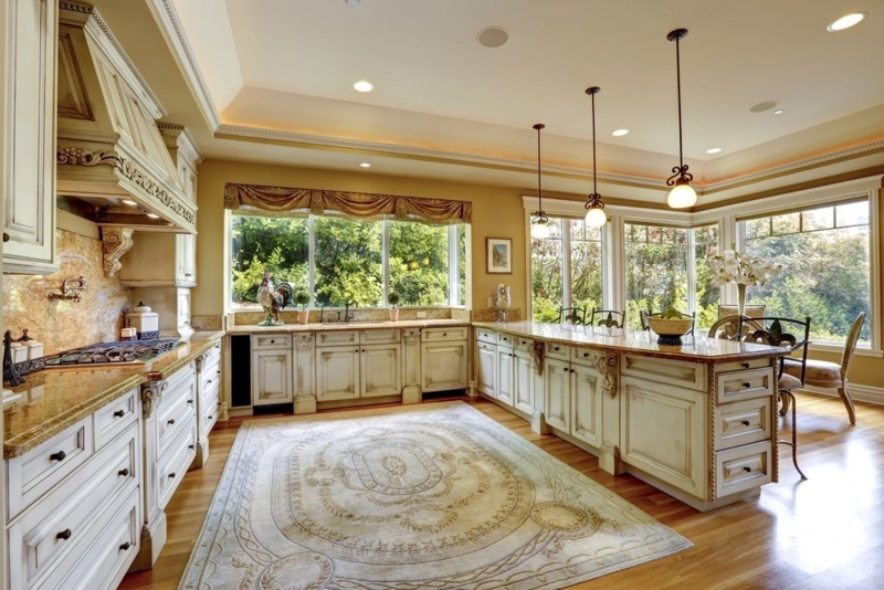 Traditional Kitchen with Ornate Range Hood & Distressed Cabinetry