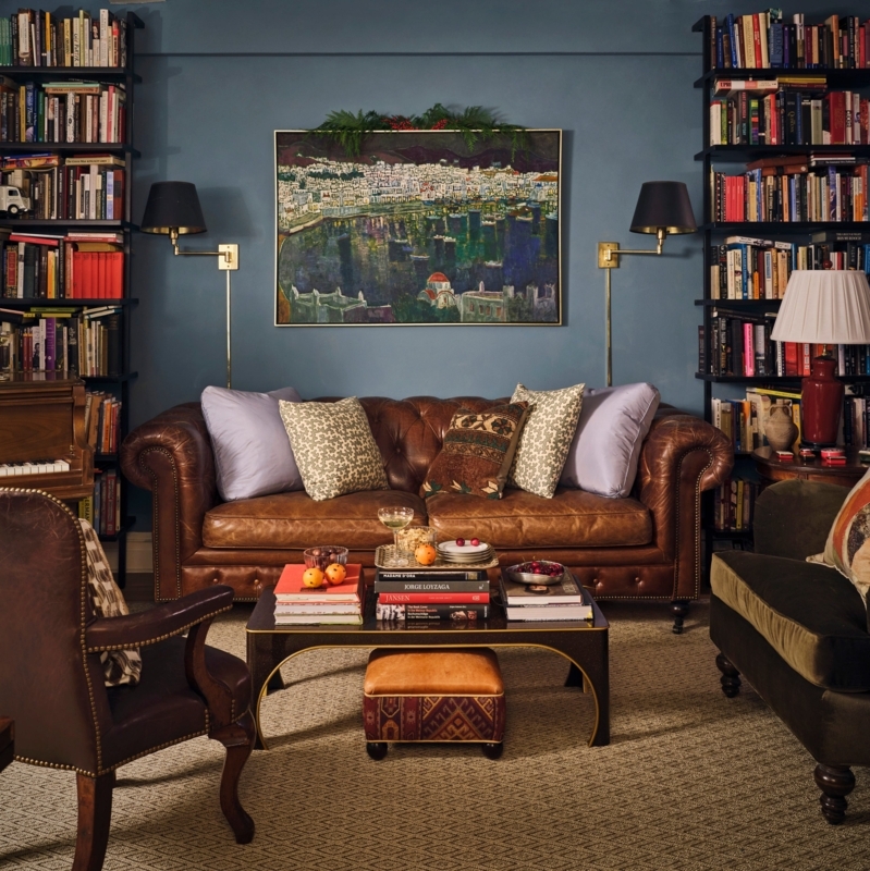 Traditional Library Living Room with Teal Walls and Leather Chesterfield