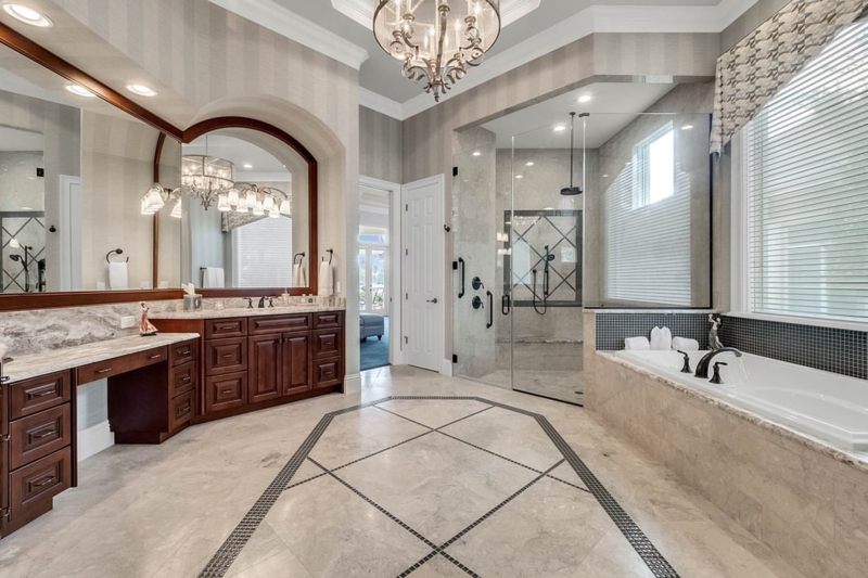 Traditional Luxury Master Bathroom Layout with Decorative Floor Inlay