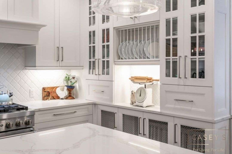 Traditional White Cabinetry with Integrated Plate Rack & Mesh Inserts