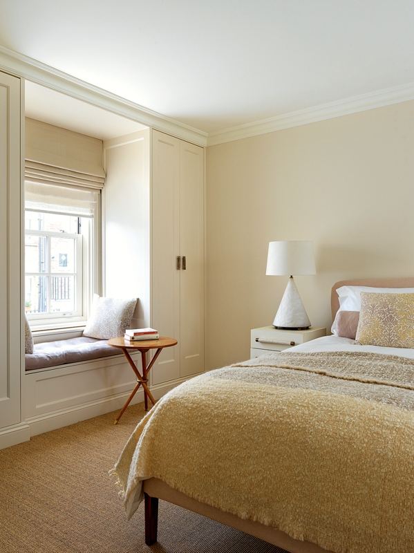 Transitional Bedroom with Built In Cabinetry and Cozy Window Seat