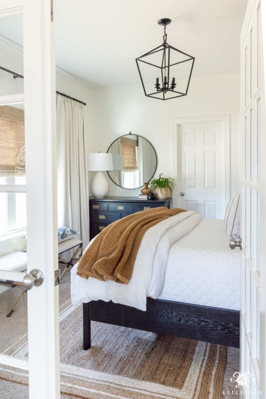 Transitional Bedroom with Geometric Pendant and Black & White Styling