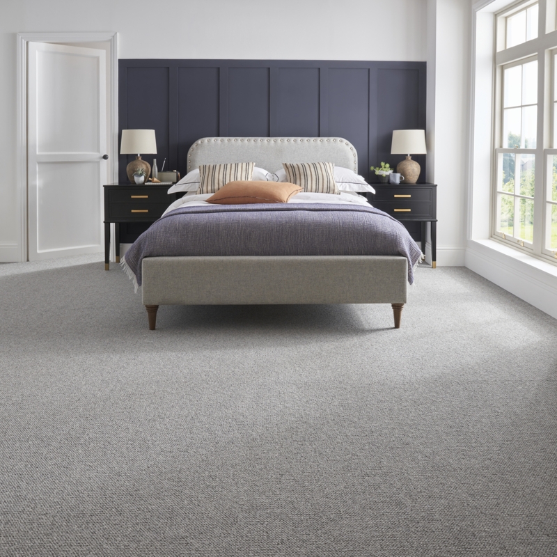 Transitional Bedroom with Grey Upholstered Bed and Navy Paneled Wall