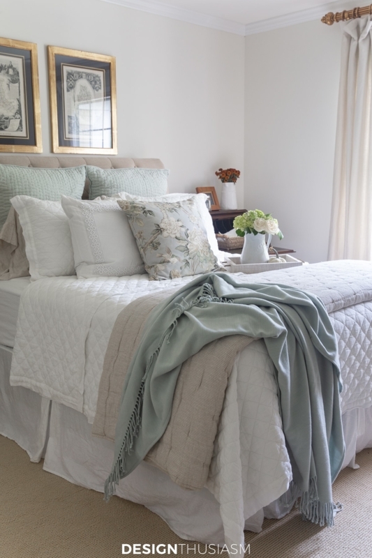 Transitional Cottage Bed with Layered Textural Bedding and Sage Accents