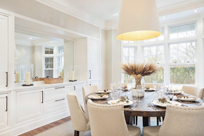 Transitional Dining Room with Round Table & Built-In Cabinetry