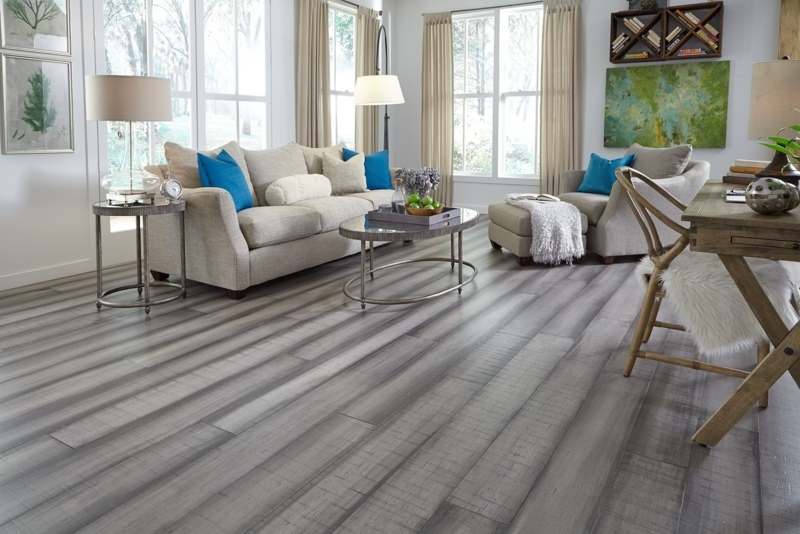 Transitional Grey Wood Floor Living Room with Teal Accents & Desk Nook