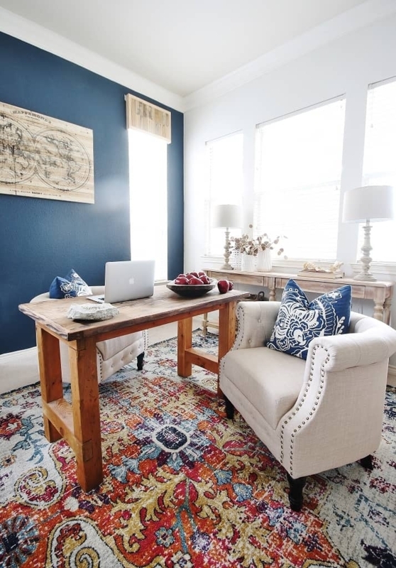 Transitional Home Office with Navy Accent Wall & Vibrant Rug