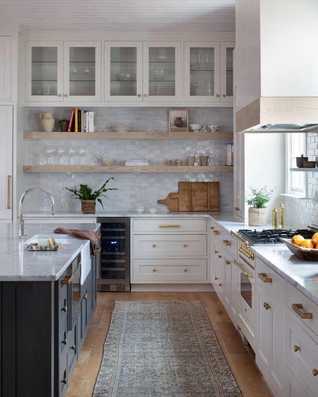 Transitional Kitchen Layout with Navy Island Contrast & Brass Hardware