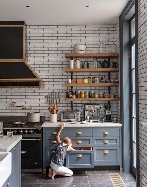 Transitional Kitchen with Blue Cabinets, Gold Hardware, and Wood Shelves
