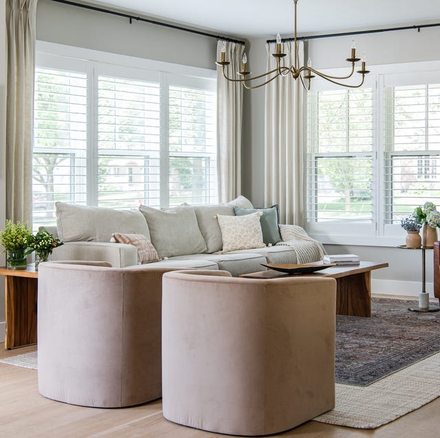 Transitional Layered Curtains over Shutters with Blush Velvet Chairs