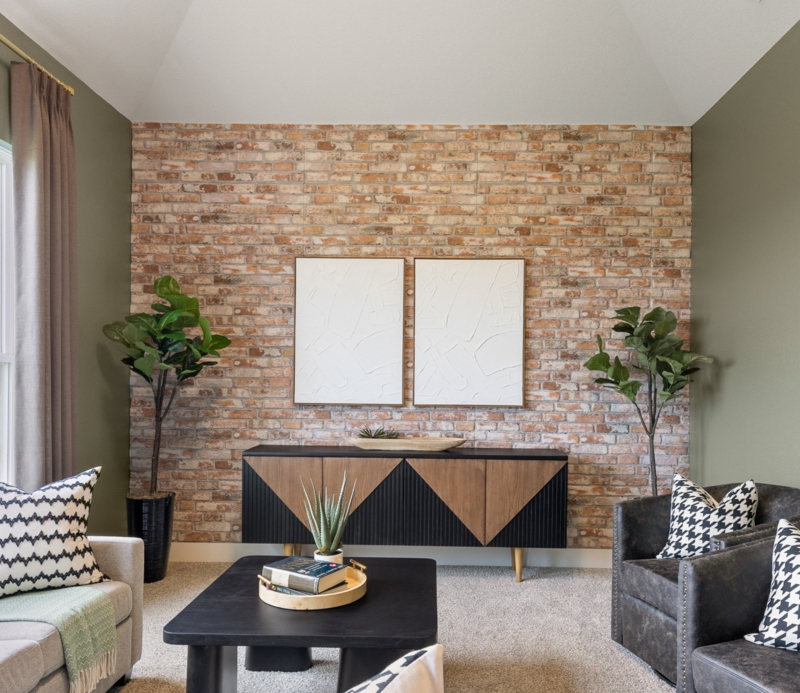 Transitional Living Room: Distressed Brick Accent Wall & Geometric Sideboard