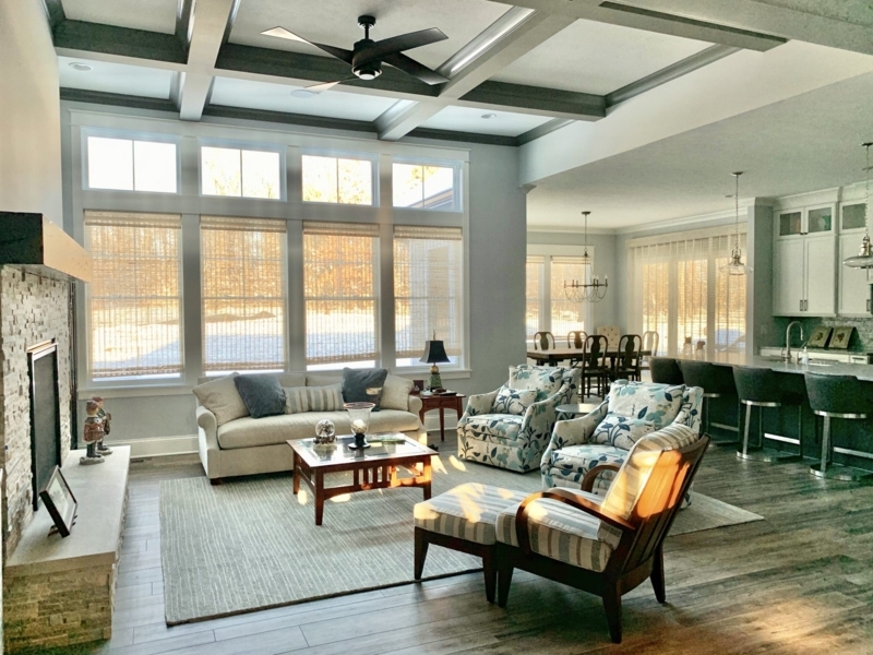 Transitional Living Room with Coffered Ceiling and Woven Window Shades