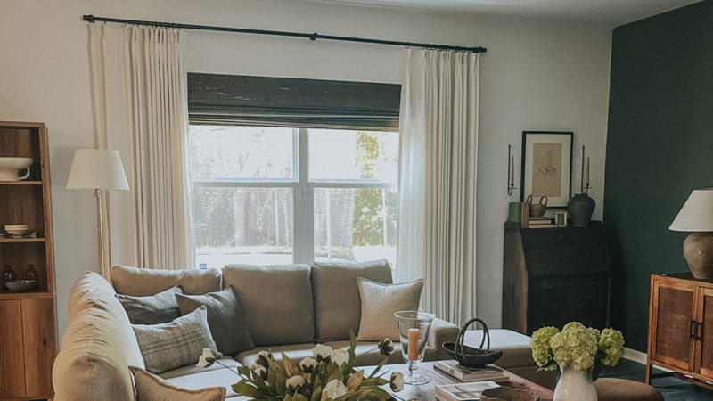 Transitional Living Room with Dark Green Accent Wall and Secretary Desk