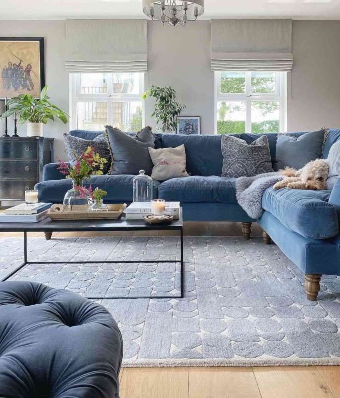 Transitional Sectional with Geometric Carved Rug and Turned Wooden Legs