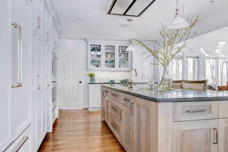 Transitional White Kitchen with Wood Island Base and Hardwood Floors.