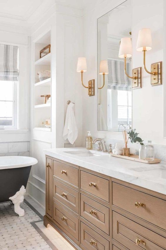 Transitional Wood Double Vanity with Black Clawfoot Tub and Brass Sconces