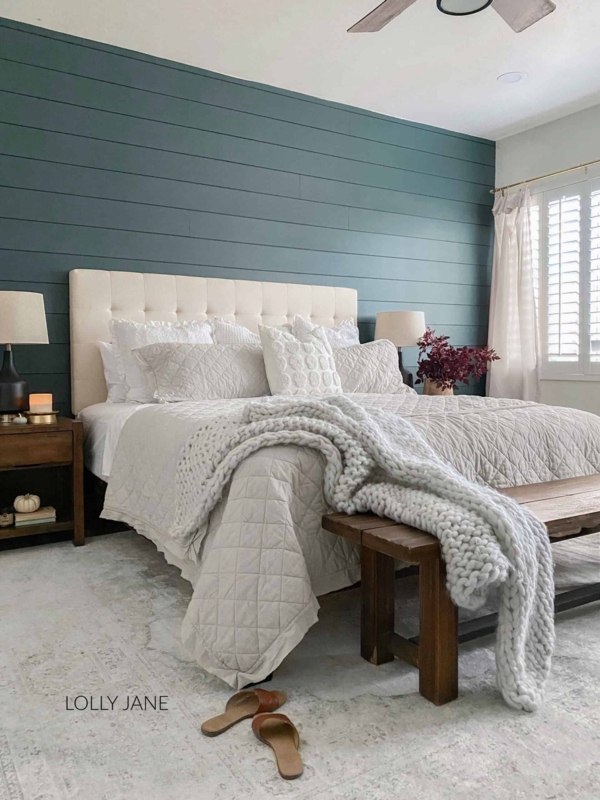 Tufted Headboard Bed with a Teal Shiplap Wall and Chunky Knit Throw