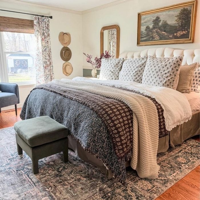 Tufted Headboard with Floral Pillows in Cozy Cottagecore Bedroom Decor